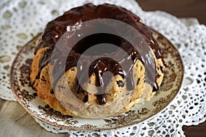 Bundt cake or Gugelhupf, with melted chocolate photo