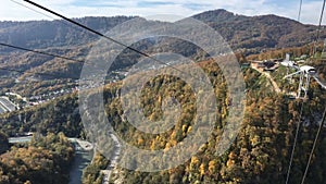 Bungee jump at AJ Hackett Sky Park on mountain forest background. Extreme activities of Sochi