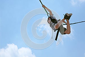 Bungee Jumping Boy Against Sky with Clipping Path