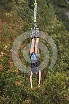Bungee jumping young woman photo