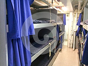 Bunk beds on board navy naval ship for war photo