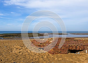 Bunker buried on sandy beach