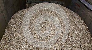 Bunker for storing wood chips for heating solid fuel industrial boilers in the boiler room.