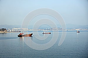 Bunkering of a ship on the open roadstead of the port of Nakhodka, Russia.