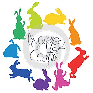 Bunnies silhouettes in rainbow colors arranged in a circle. Happy Easter. photo