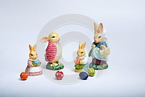 Bunny family, mother, father children with easter eggs