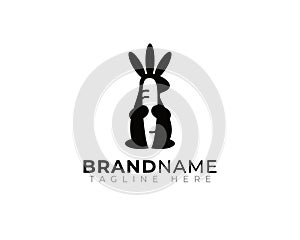 bunny hare rabbit holding carrot illustration in simple modern black flat style