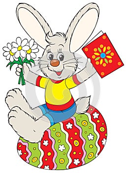 Bunny sits on the Easter egg