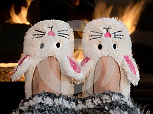 Bunny slippers by fireplace