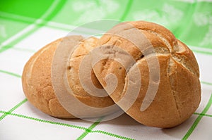 Buns on a green kitchen tablecloth