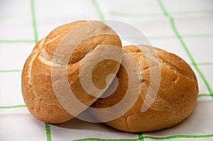 Buns on a green kitchen tablecloth