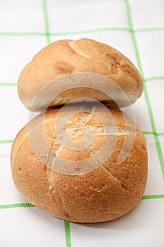 Buns on a green kitchen tablecloth