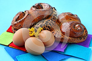 Buns with poppy seeds and brown eggs