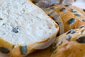 Buns with pumpkin seeds closeup.