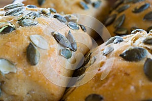 Buns with pumpkin seeds closeup.