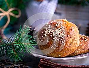 Buns with sesame on plate