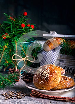 Buns with sesame on plate