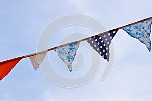 A bunting of colorful burgees flittering in the wind photo