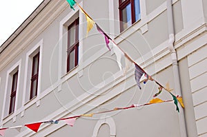 A bunting of colorful burgees flittering in the wind photo