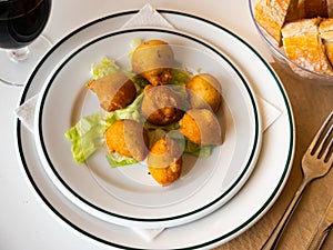 Bunuelos de bacalao - traditional Spanish cod fritters closeup