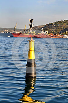 Buoy on the background of the sea port
