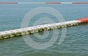 buoy barrier on sea surface to protect people from boat