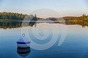 Buoy in a canadian lake of La Mauricie National Park MÃÂ©kinac, Quebec photo