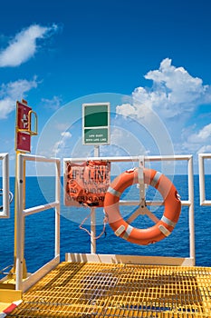 Buoy with life line and ESD emergency shutdown station at the escape way photo