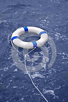 Buoy, lifebelt, lifesaver floating in ocean as help equipment