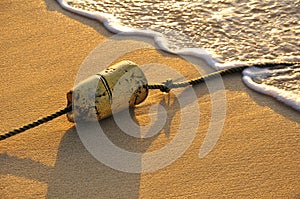 Buoy in the Sand