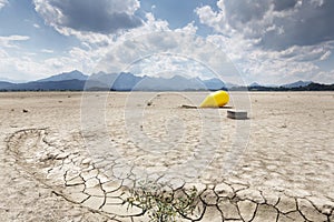 Buoy in the waterless Forggensee lake in Bavaria, Germany