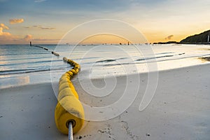 Buoyancy on the beach, sign warning dangerous