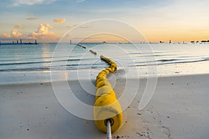 Buoyancy on the beach, sign warning dangerous