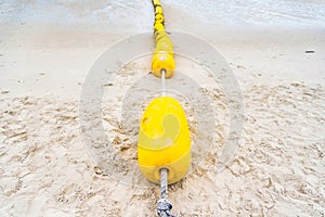 Buoyancy on the beach, sign warning dangerous