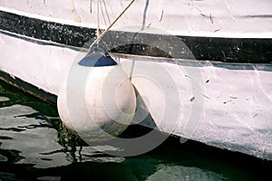 Buoys and anchor ropes on fishing boat, close up