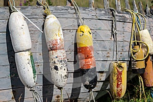 Buoys hanging from the side of an old weathered abandoned boat