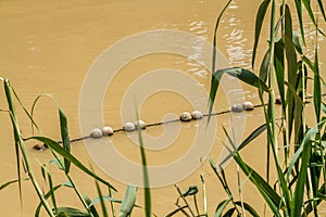 Buoys on Jordan River in Qasr el Yahud, Israel