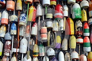 Buoys on the side of a beach shack