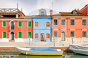 The Burano island near Venice, a canal with colorful houses