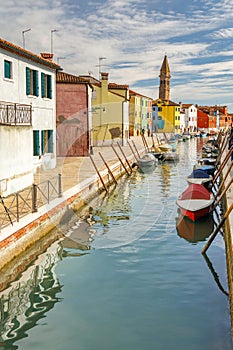 The Burano island near Venice, a canal with colorful houses