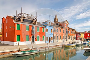 The Burano island near Venice, a canal with colorful houses
