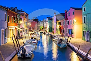 Burano island at night, Venice, Venetian Lagoon, Italy. Colourfully painted houses facades along the small beautiful canal with