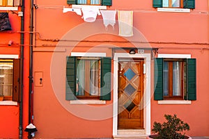 Burano, Venezia, Italy. Details of the windows and doors of the colorful houses in Burano island