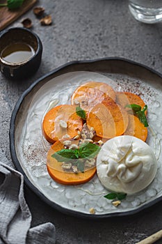 Buratta italian cheese snack served on handmade plate