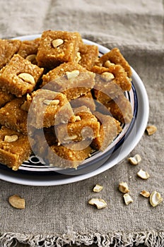 Burfi - indian sweet with milk, chickpea flour, coconut flakes