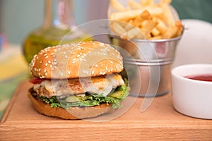 Burger with chicken cutlet and fries