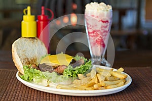 Burger and chips with a milkshake
