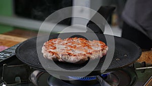 Burger cutlet on metal pan. Background, succulent.