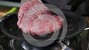 Burger cutlet on metal pan. Background, succulent.