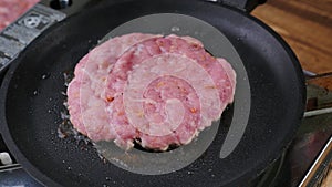 Burger cutlet on metal pan. Fried, background.